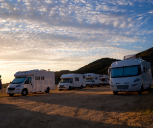 RVs parked at sunset